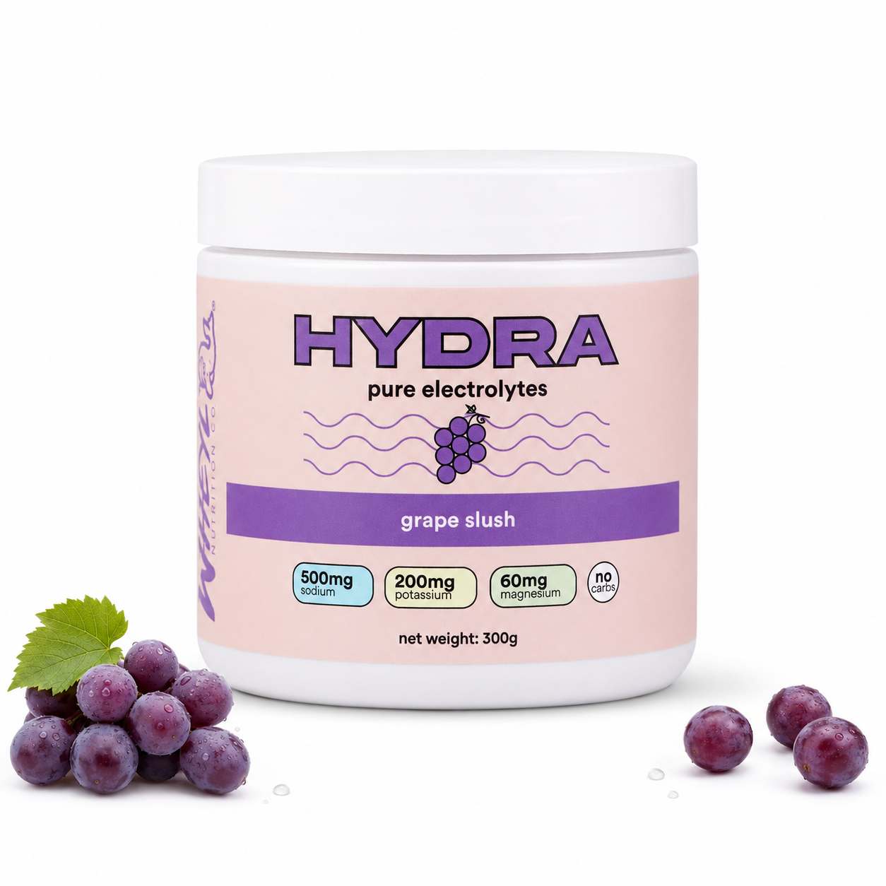 A white plastic tub of Hydra Pure Electrolytes in grape slush flavor, shown on a white background with purple grapes and a green leaf at the bottom left and right.